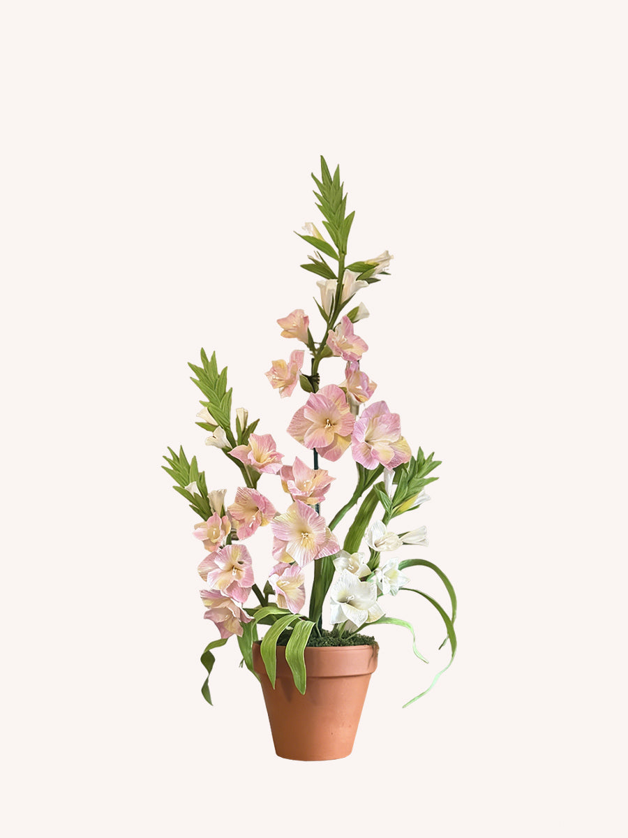 Gladiolus flowers made of realistic crepe paper in a terracotta pot.